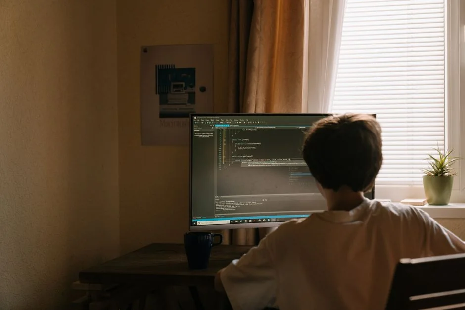 A modern computer screen displaying web design work, showcasing creative visuals in a workspace.